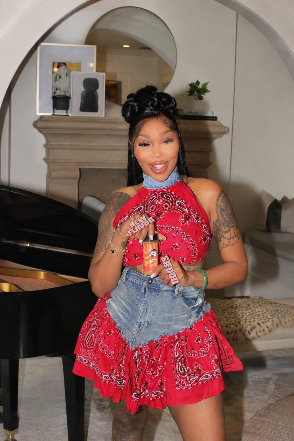 Sierra holding Slappin' SiFood seasoning indoors